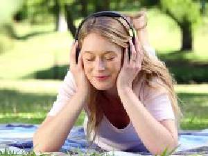 Image Of A Lady Listens Music in a Beautiful Environment For Getting Good Mood