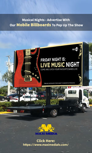 A Classic & Attractive Mobile Billboard Advertisement Truck Driving Down The Road On Las Vegas Which Is About A Grand Musical Night.